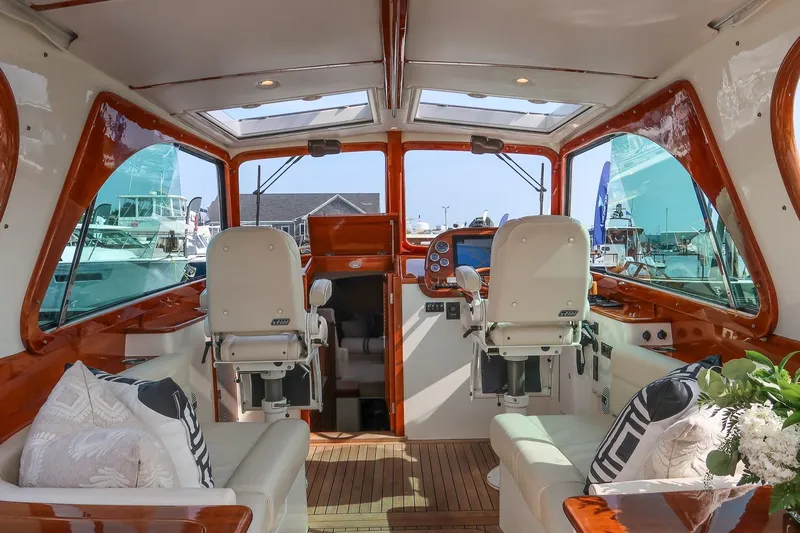 Bristol Yacht Photos Pics Interior of 2015 Hinckley Picnic Boat 37 MKIII with luxurious seating and helm.