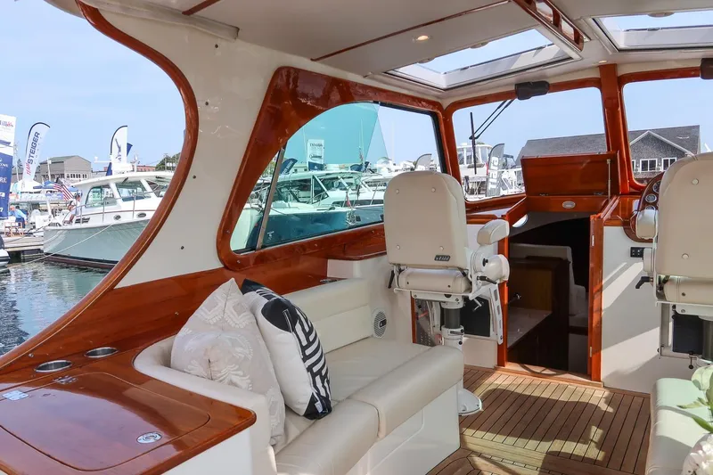 Bristol Yacht Photos Pics Interior of 2015 Hinckley Picnic Boat 37 MKIII with luxurious seating and wood accents.