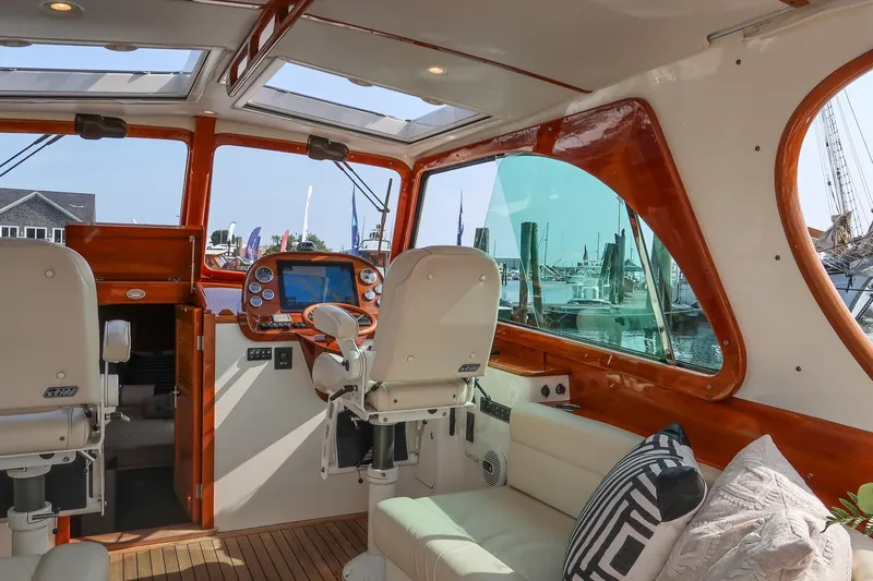Bristol Yacht Photos Pics Interior of 2015 Hinckley Picnic Boat 37 MKIII, featuring helm station and seating area.