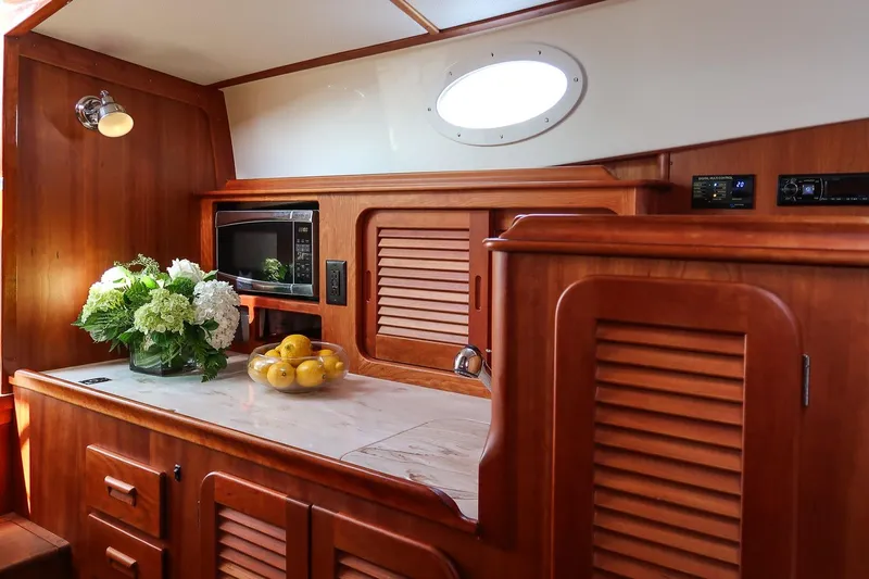 Bristol Yacht Photos Pics Luxurious interior of 2015 Hinckley Picnic Boat 37 MKIII with elegant wood finish.