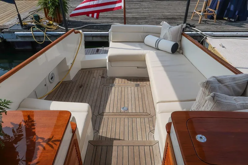 Bristol Yacht Photos Pics Luxurious seating area on a 2015 Hinckley Picnic Boat 37 MKIII with teak flooring.