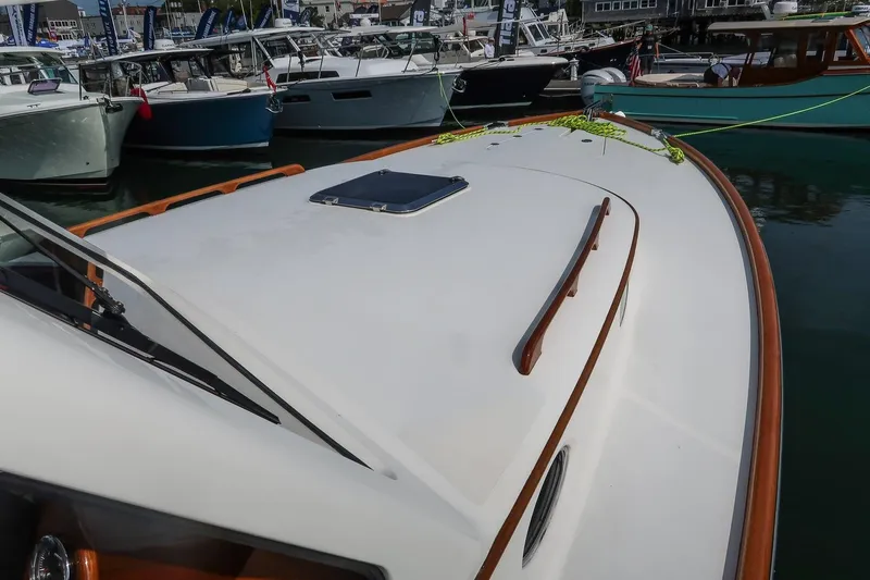 Bristol Yacht Photos Pics 2015 Hinckley Picnic Boat 37 MKIII docked among other boats at a marina.