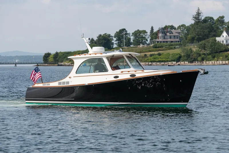 Bristol Yacht Photos Pics 2015 Hinckley Picnic Boat 37 MKIII cruising on a scenic waterway.