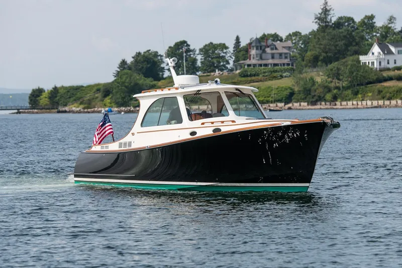 Bristol Yacht Photos Pics 2015 Hinckley Picnic Boat 37 MKIII cruising on a scenic waterway.