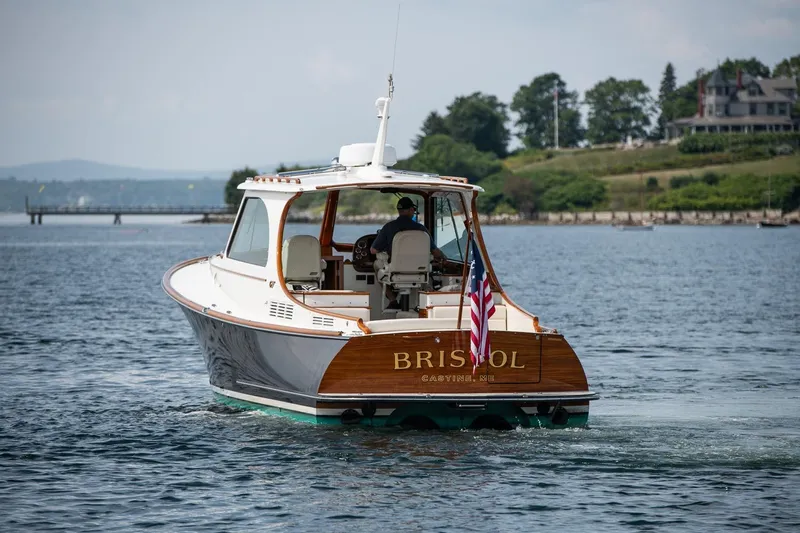 Bristol Yacht Photos Pics 2015 Hinckley Picnic Boat 37 MKIII cruising on a scenic waterway.