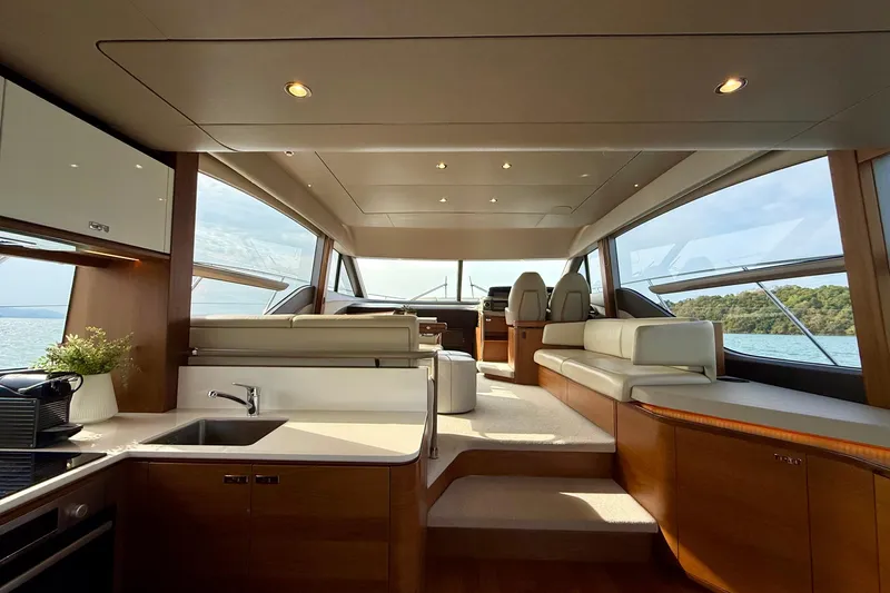 Lariel Yacht Photos Pics Luxurious interior of 2020 Princess F55 yacht with modern design and panoramic windows.