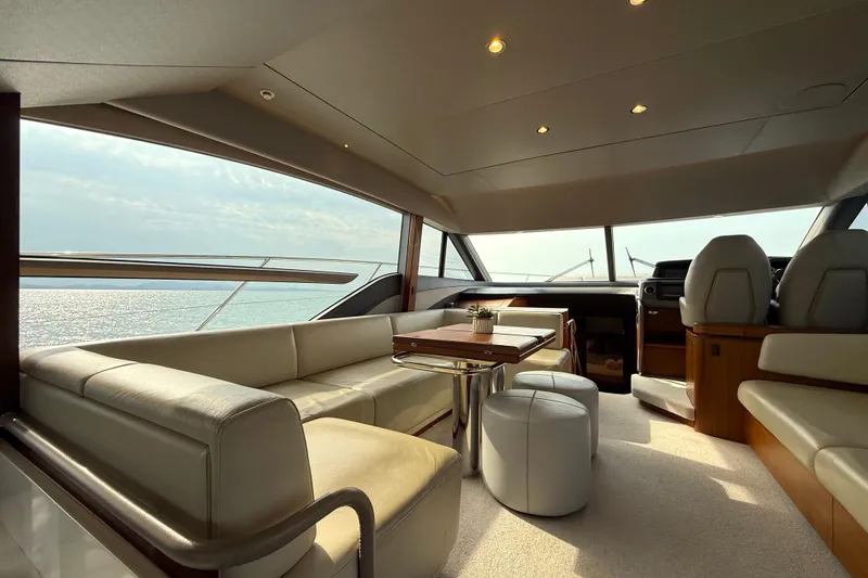 Lariel Yacht Photos Pics Luxurious interior of 2020 Princess F55 yacht with elegant seating and ocean view.