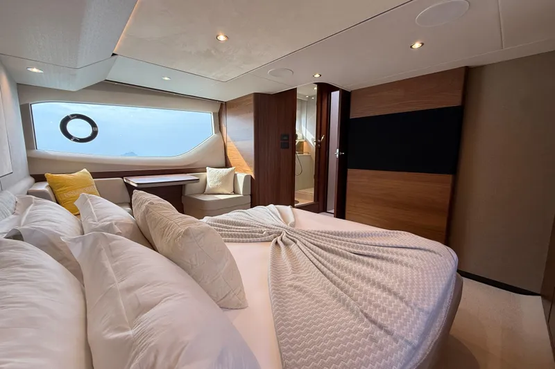 Lariel Yacht Photos Pics Luxurious 2020 Princess F55 yacht bedroom with elegant decor and ocean view.