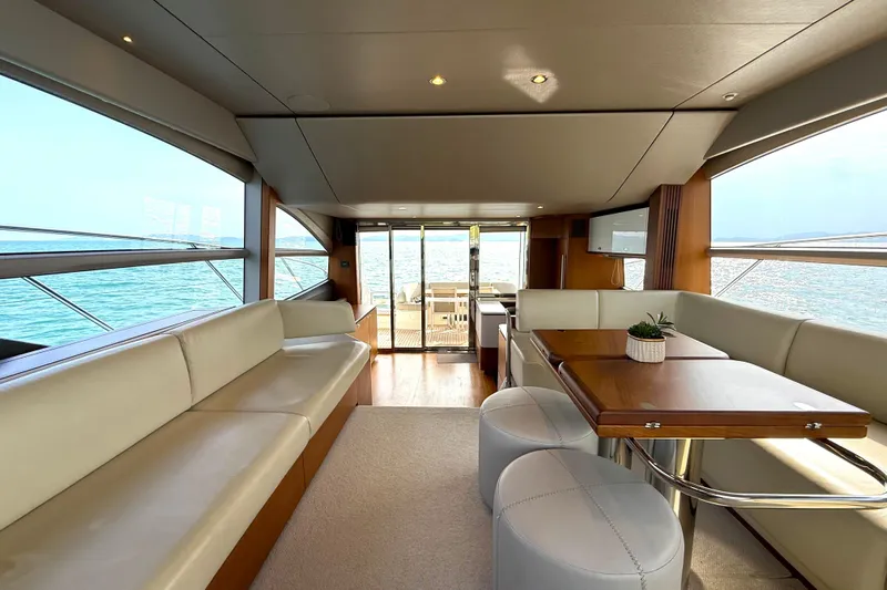 Lariel Yacht Photos Pics Luxurious interior of 2020 Princess F55 yacht with elegant seating and ocean view.