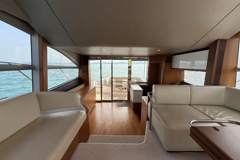 Lariel Yacht Photos Pics Luxurious interior of 2020 Princess F55 yacht with elegant seating and ocean view.