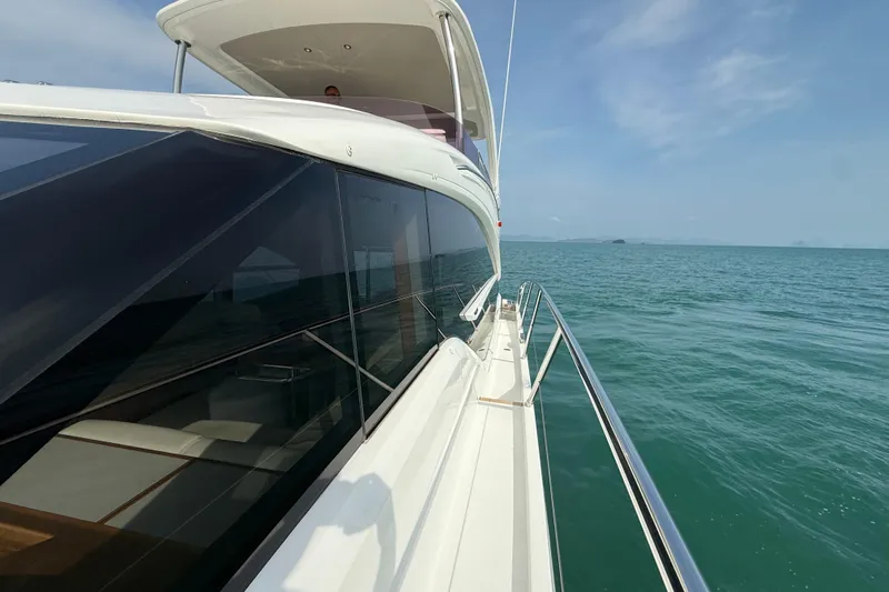 Lariel Yacht Photos Pics 2020 Princess F55 yacht cruising on calm blue ocean waters under clear skies.