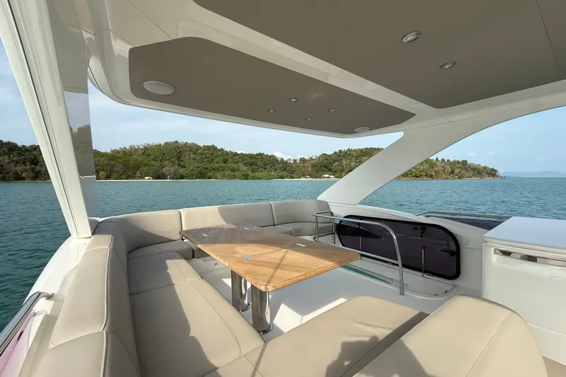 Lariel Yacht Photos Pics Luxurious 2020 Princess F55 yacht interior with elegant seating and scenic ocean view.