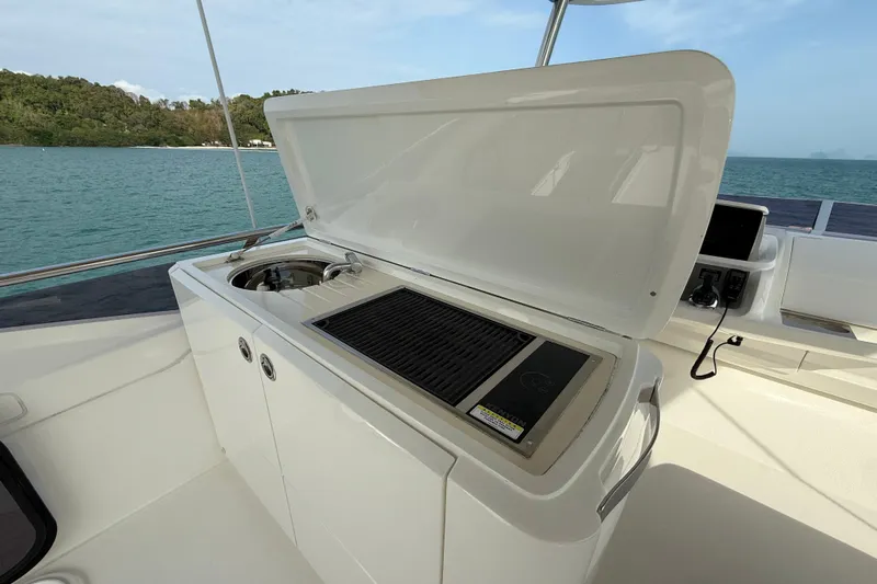 Lariel Yacht Photos Pics Outdoor kitchen on 2020 Princess F55 yacht with grill and sink, ocean view.