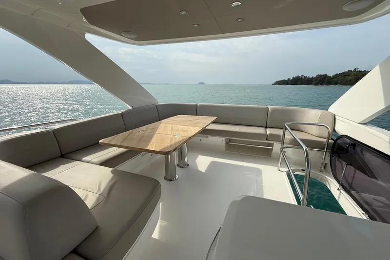 Lariel Yacht Photos Pics Luxurious 2020 Princess F55 yacht interior with elegant seating and ocean view.