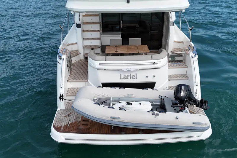 Lariel Yacht Photos Pics Sleek 2020 Princess F55 yacht with tender on the water, showcasing luxury design.