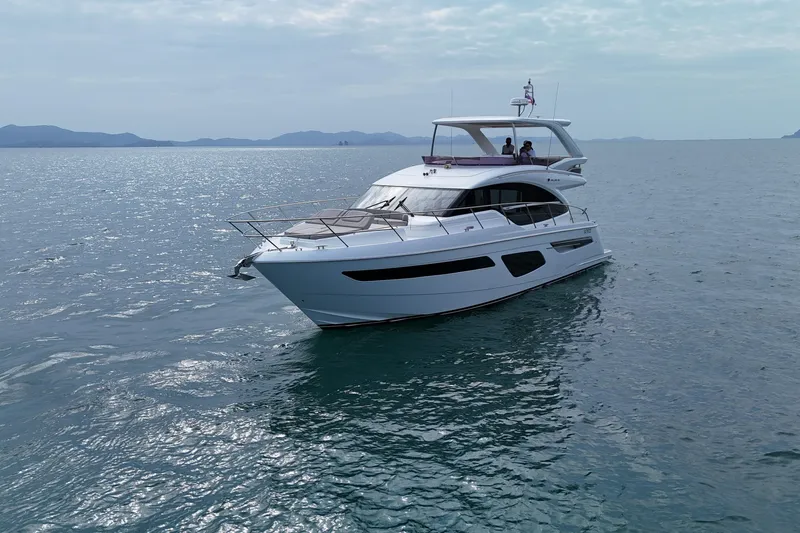 Lariel Yacht Photos Pics 2020 Princess F55 yacht cruising on calm ocean waters.