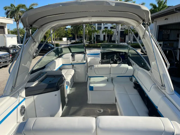  Yacht Photos Pics 2020 Formula 310 Bowrider boat interior with white seating and modern dashboard.