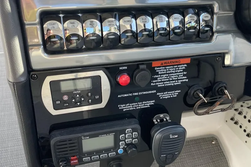 Yacht Photos Pics Control panel of a 2020 Formula 310 Bowrider boat with switches and warning labels.