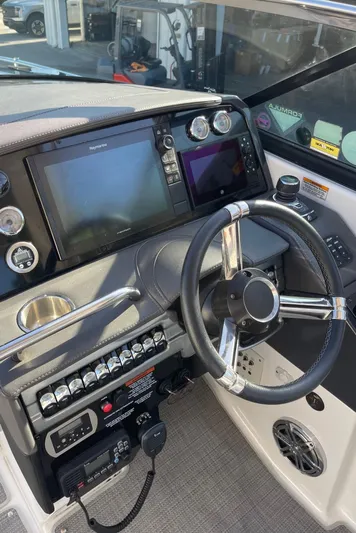  Yacht Photos Pics 2020 Formula 310 Bowrider helm with modern controls and navigation displays.