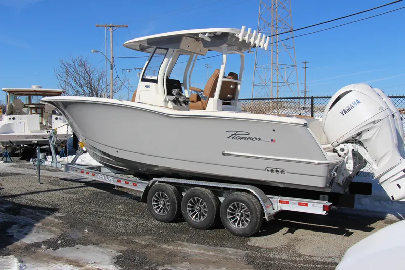  Yacht Photos Pics 2026 Pioneer 270 Pelagic boat on trailer with Yamaha engine, displayed outdoors.
