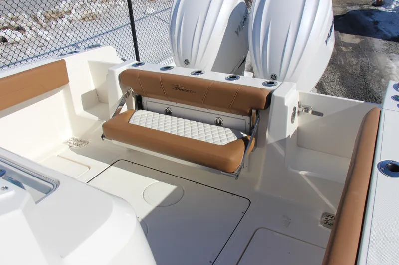  Yacht Photos Pics 2026 Pioneer 270 Pelagic boat interior with tan seating and dual outboard engines.