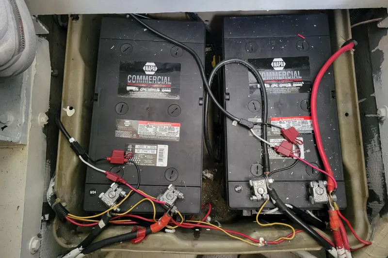 Bout Time Yacht Photos Pics Battery compartment of a 1979 Bertram 38 Convertible with NAPA commercial batteries.