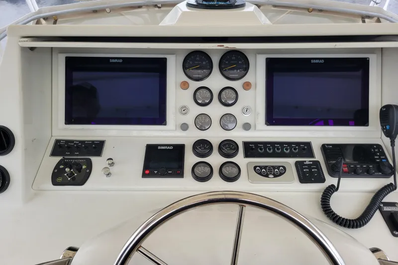 Bout Time Yacht Photos Pics 1979 Bertram 38 Convertible helm with Simrad displays and control panels.