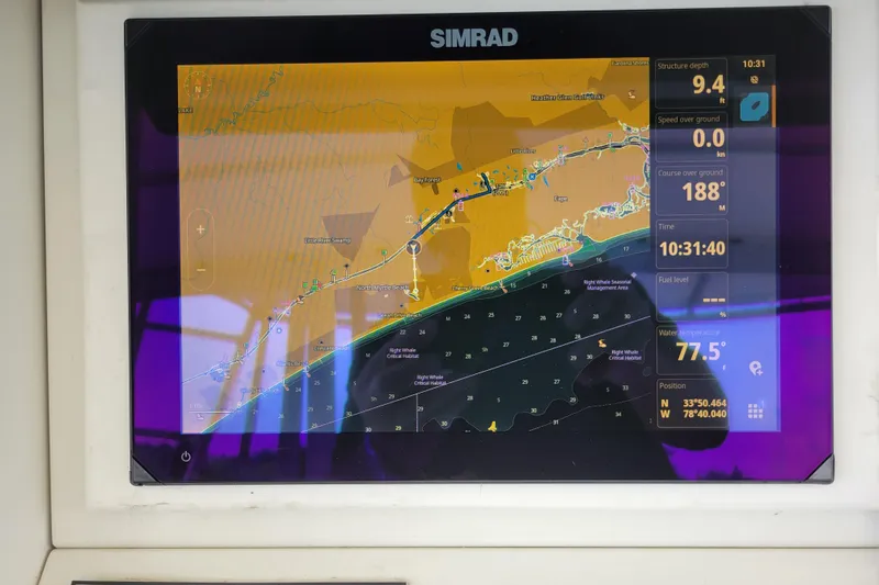 Bout Time Yacht Photos Pics Simrad navigation display on 1979 Bertram 38 Convertible boat, showing map and data.