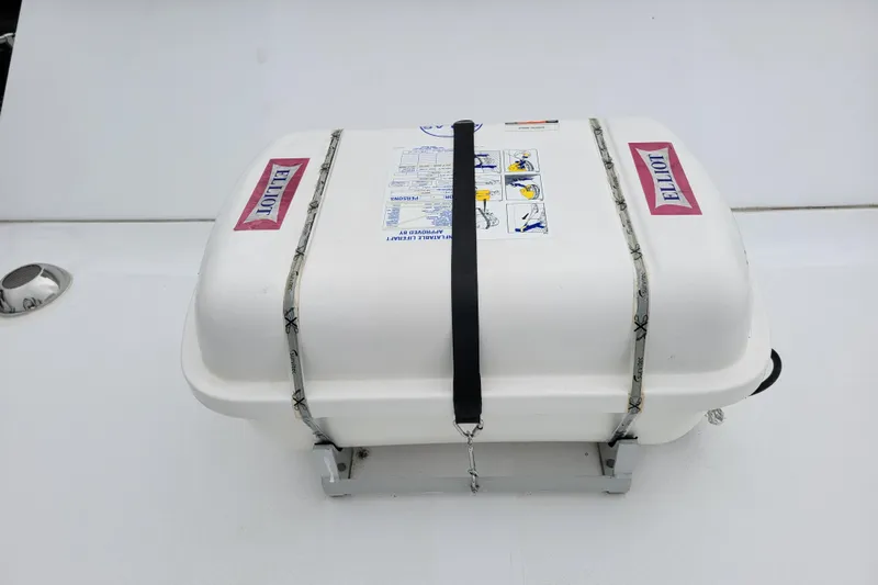 Bout Time Yacht Photos Pics White life raft container on a 1979 Bertram 38 Convertible boat deck.