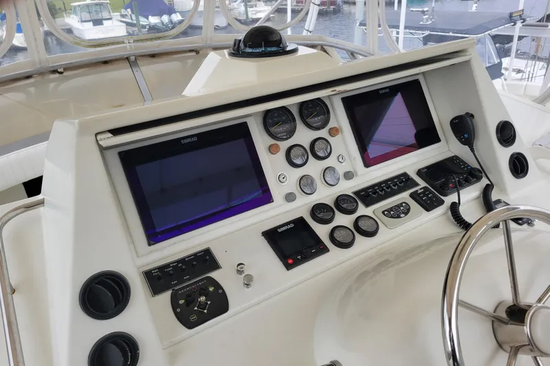 Bout Time Yacht Photos Pics 1979 Bertram 38 Convertible yacht dashboard with navigation instruments and controls.