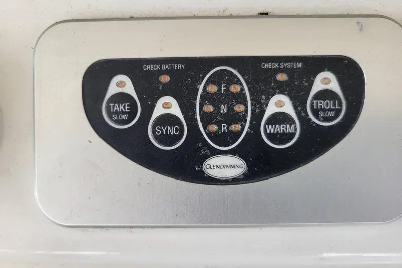 Bout Time Yacht Photos Pics Control panel of a 1979 Bertram 38 Convertible boat with various function buttons.