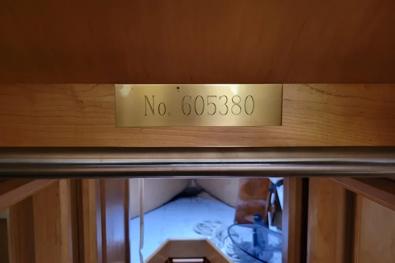 Bout Time Yacht Photos Pics Interior view of 1979 Bertram 38 Convertible with brass plaque number 605380.