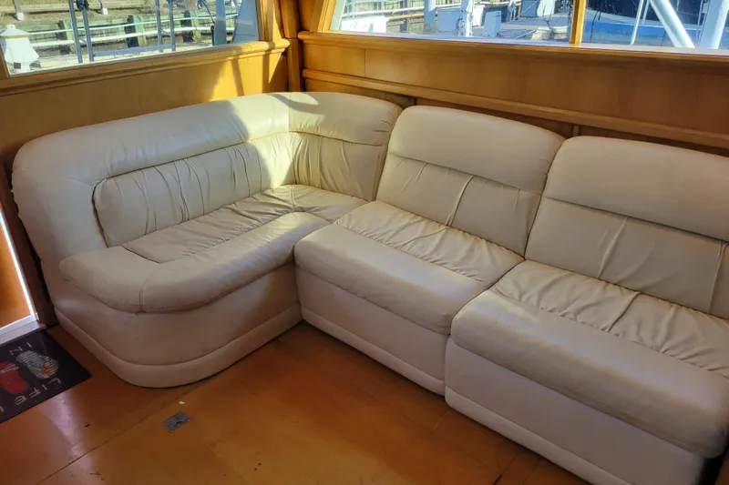 Bout Time Yacht Photos Pics Cream leather sofa in 1979 Bertram 38 Convertible yacht interior.