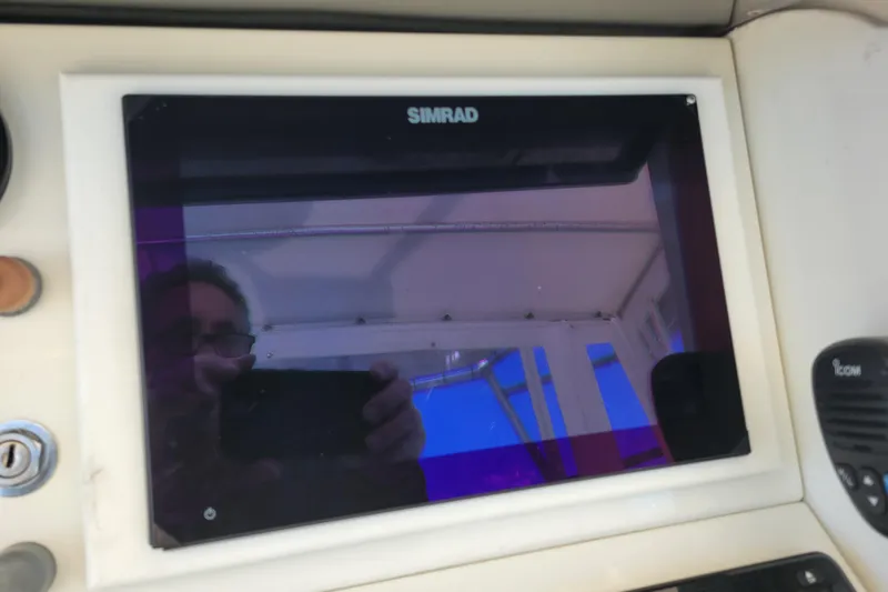 Bout Time Yacht Photos Pics Simrad display on 1979 Bertram 38 Convertible boat dashboard.