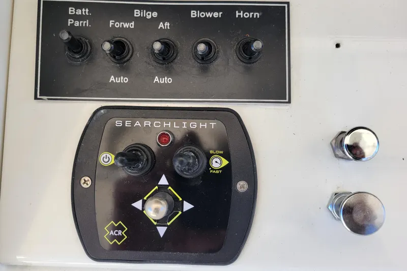 Bout Time Yacht Photos Pics Control panel of a 1979 Bertram 38 Convertible boat with searchlight and switches.
