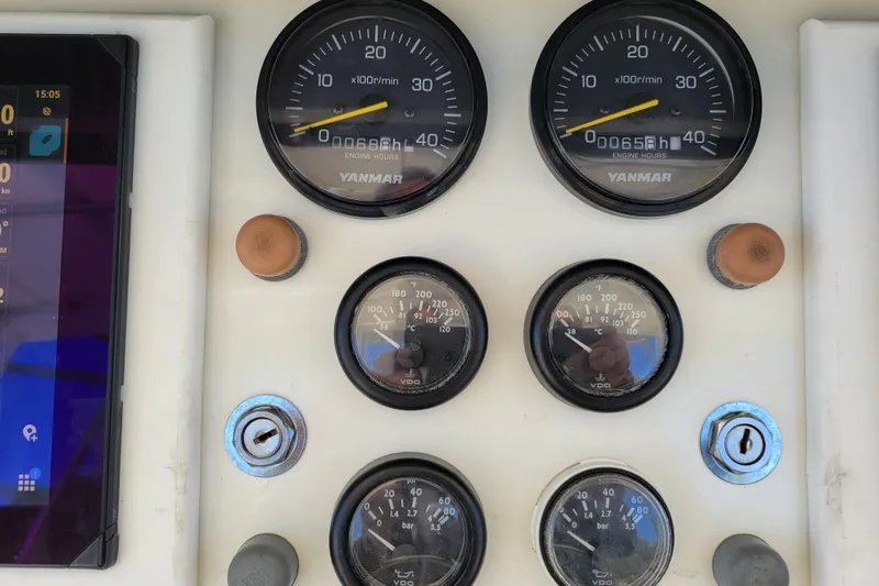 Bout Time Yacht Photos Pics Instrument panel of a 1979 Bertram 38 Convertible boat with Yanmar gauges.