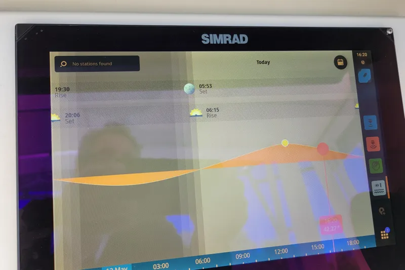 Bout Time Yacht Photos Pics Simrad marine display showing tide and sun data on a 1979 Bertram 38 Convertible.