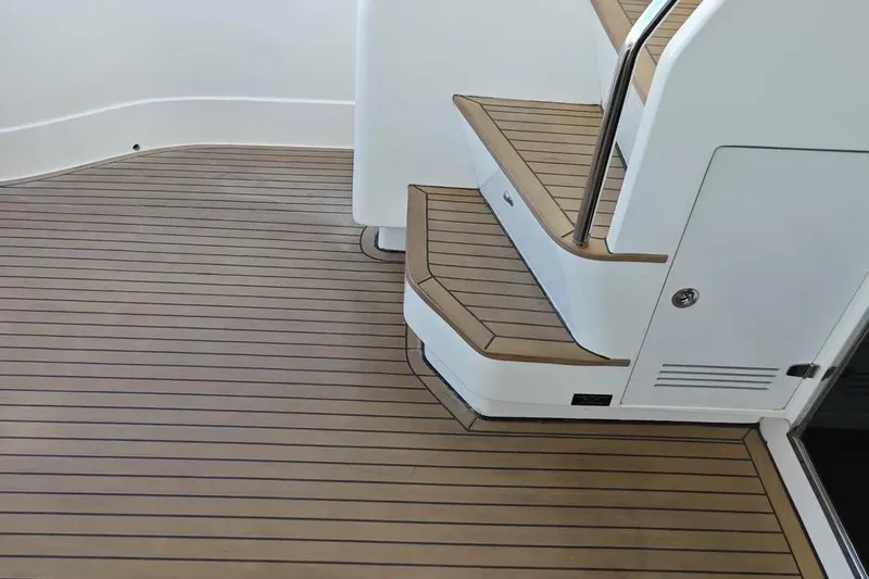  Yacht Photos Pics Teak deck and stairs on 2002 Ferretti Yachts 720, showcasing elegant marine design.