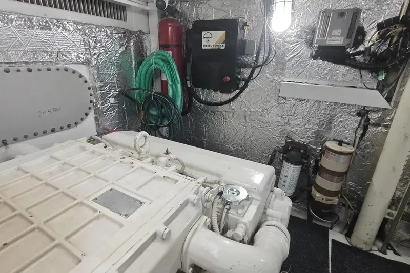  Yacht Photos Pics Engine room of 2002 Ferretti Yachts 720, featuring equipment and metallic insulation.