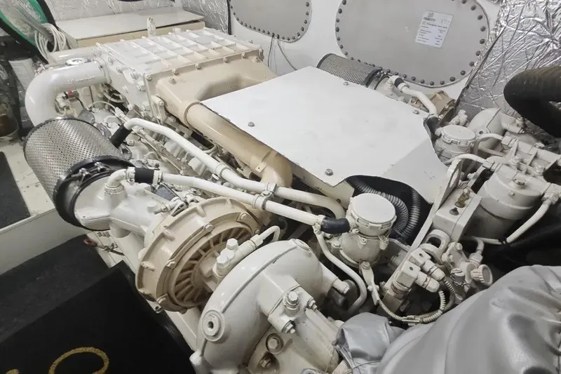  Yacht Photos Pics Engine room of a 2002 Ferretti Yachts 720, showcasing intricate machinery and components.