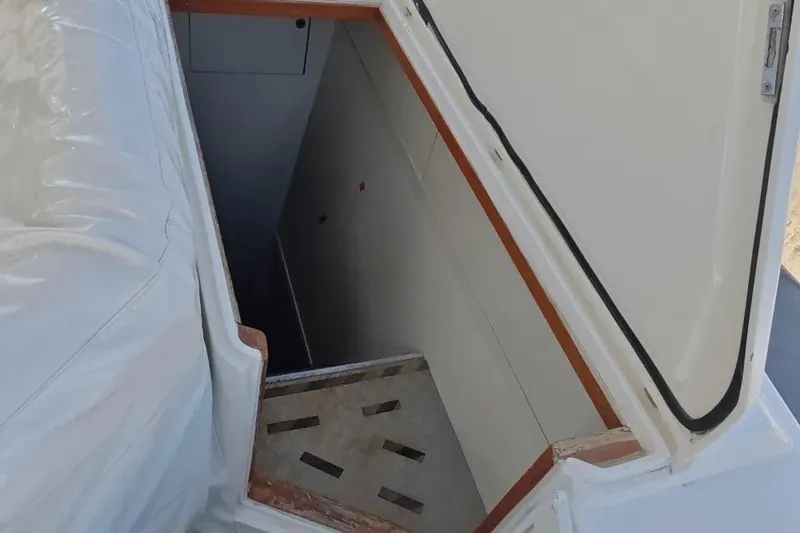  Yacht Photos Pics Open hatch on 2002 Ferretti Yachts 720, revealing interior stairs.