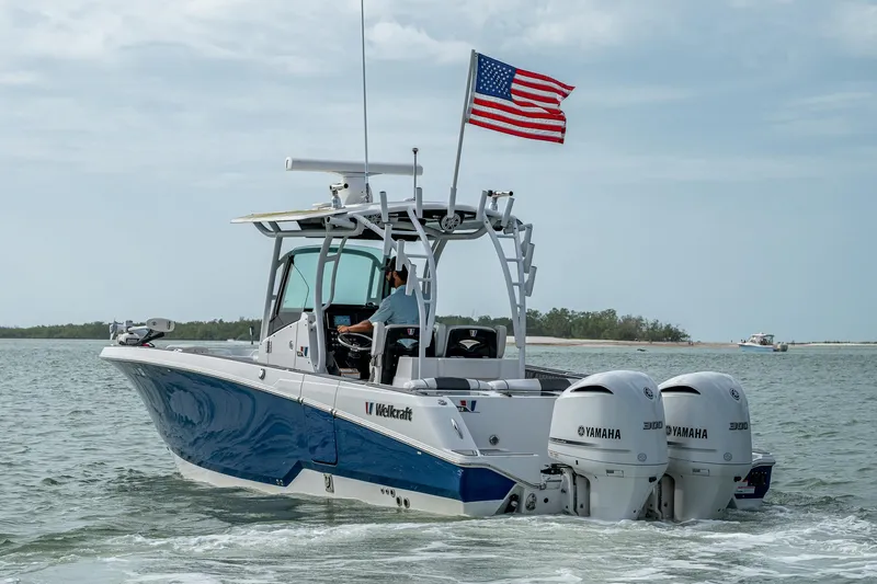  Yacht Photos Pics 2020 Wellcraft 302 Fisherman boat with dual Yamaha engines on open water.