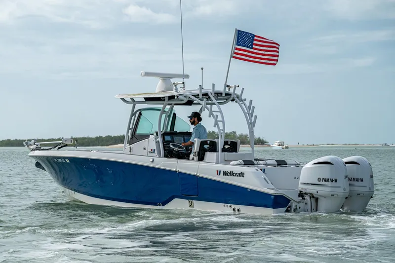  Yacht Photos Pics 2020 Wellcraft 302 Fisherman boat with dual Yamaha engines on open water.