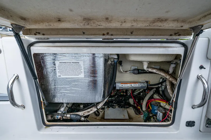  Yacht Photos Pics 2020 Wellcraft 302 Fisherman engine compartment with wiring and components visible.