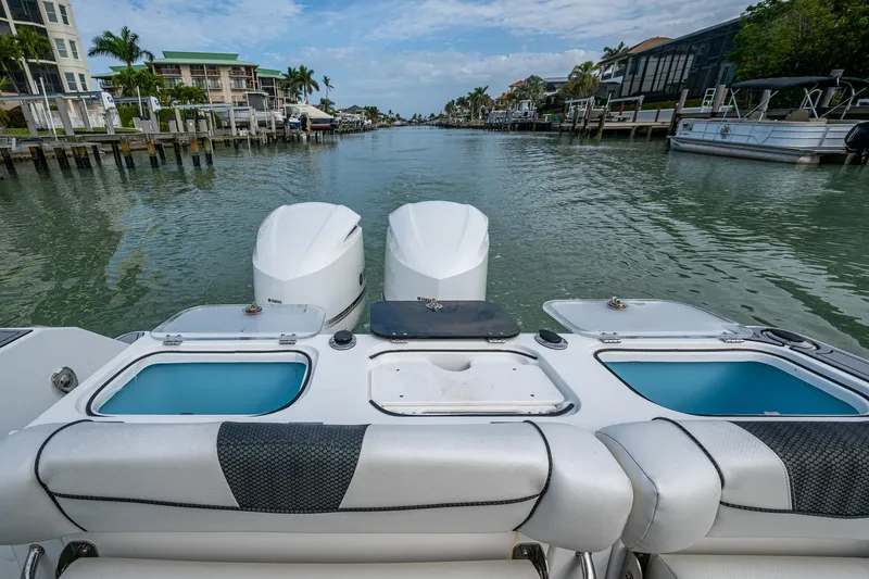  Yacht Photos Pics 2020 Wellcraft 302 Fisherman boat with dual engines on a scenic waterway.