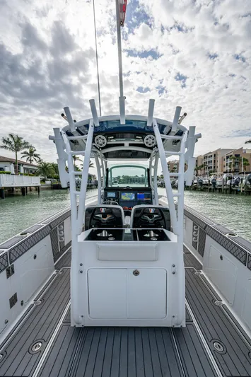  Yacht Photos Pics 2020 Wellcraft 302 Fisherman boat with dual consoles, docked in a scenic marina.