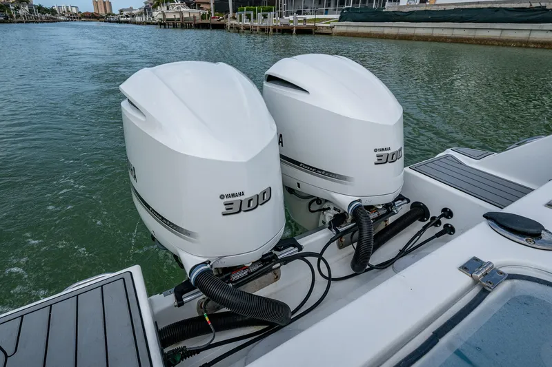  Yacht Photos Pics Twin Yamaha 300 engines on a 2020 Wellcraft 302 Fisherman boat in a marina.