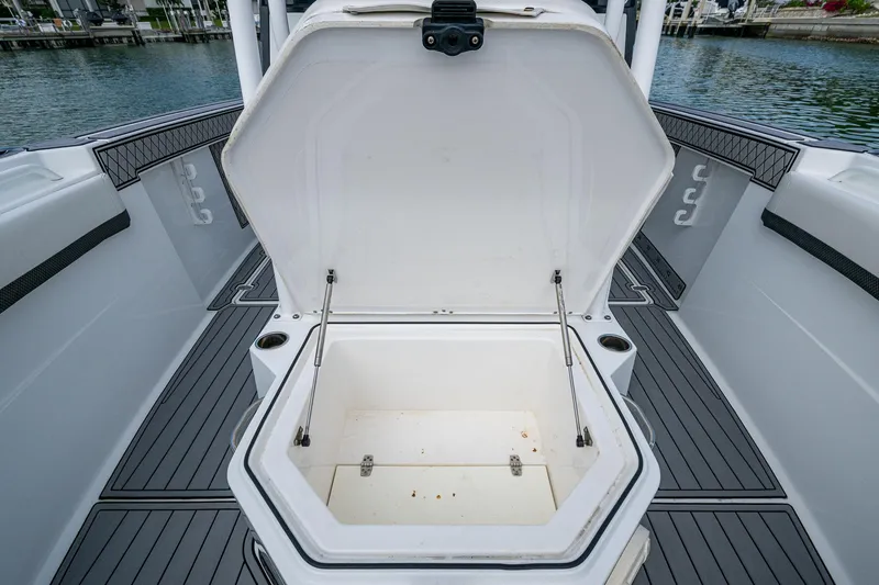  Yacht Photos Pics 2020 Wellcraft 302 Fisherman boat with open storage compartment on deck.