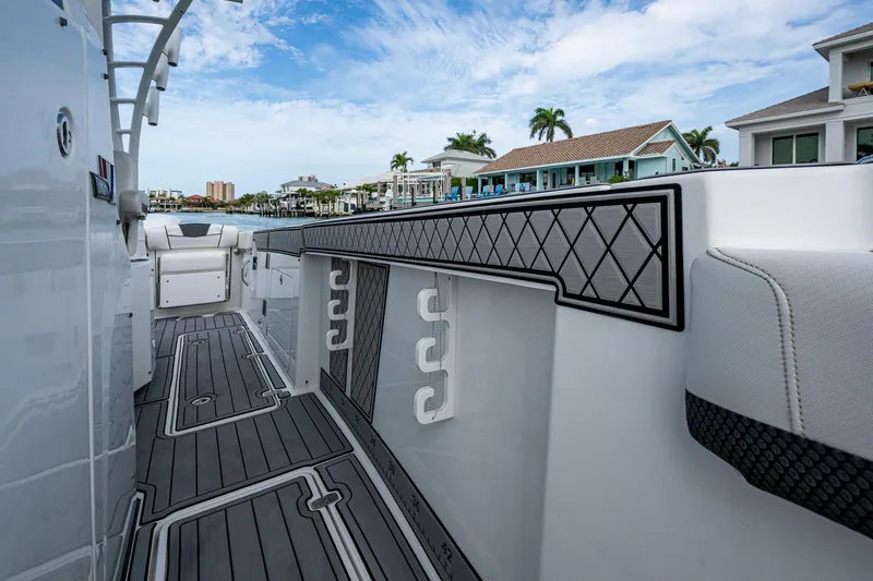 Yacht Photos Pics 2020 Wellcraft 302 Fisherman boat deck with modern design and waterfront view.