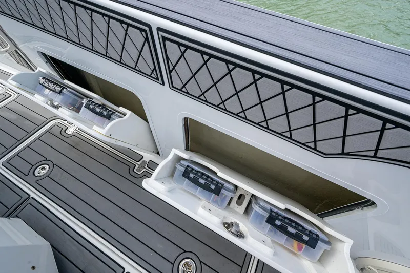  Yacht Photos Pics 2020 Wellcraft 302 Fisherman boat storage compartments with tackle boxes on deck.